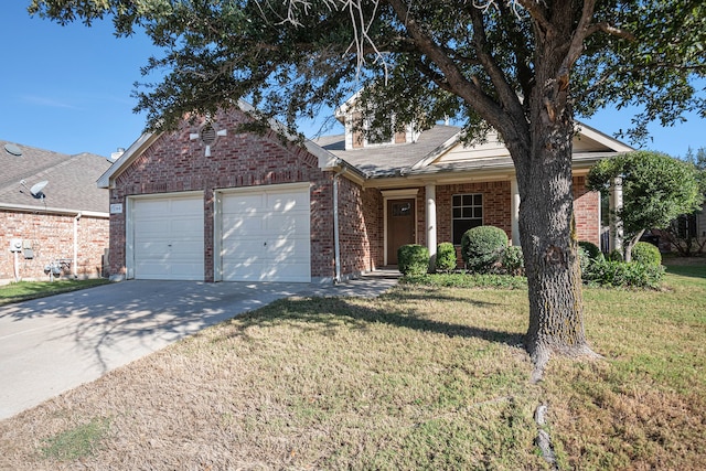 view of front of house featuring a front yard and a garage