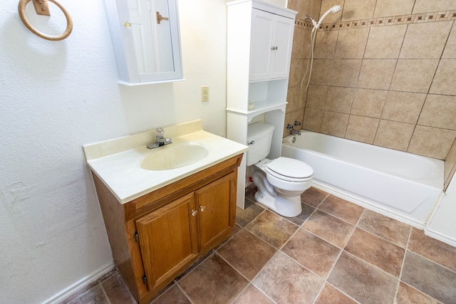 full bathroom with vanity, toilet, and tiled shower / bath combo