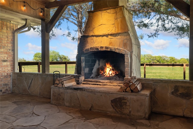 details featuring an outdoor stone fireplace