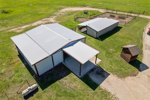 birds eye view of property featuring a rural view