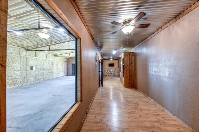 hall with light hardwood / wood-style flooring