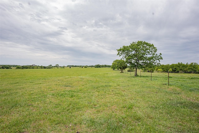 view of yard with a rural view