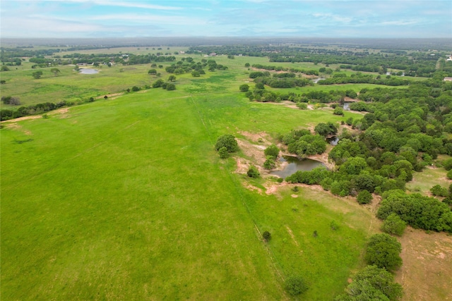 birds eye view of property with a rural view