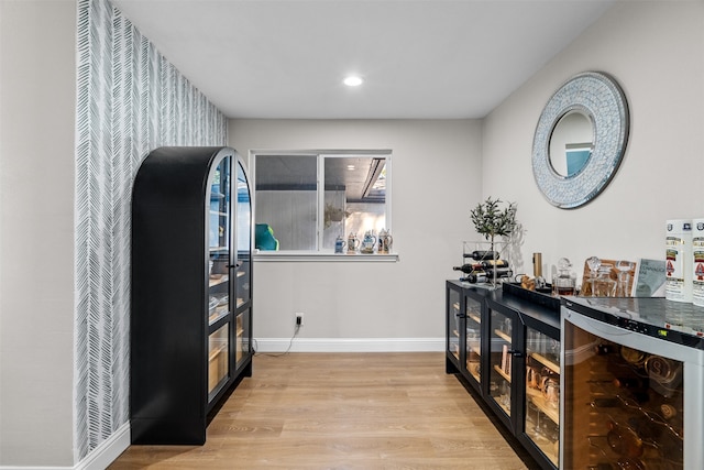 interior space featuring light hardwood / wood-style floors and wine cooler