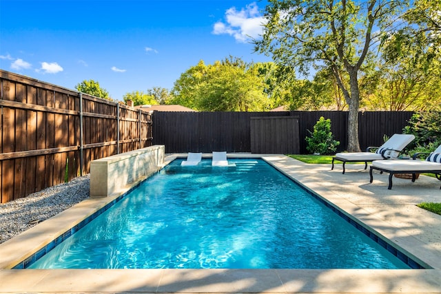 view of swimming pool with a patio