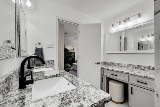 bathroom featuring tile patterned floors and vanity