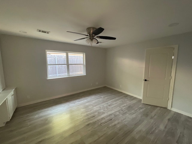 unfurnished room featuring ceiling fan and light wood-type flooring