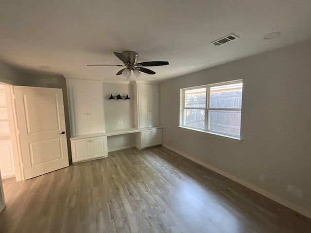 unfurnished bedroom with light hardwood / wood-style flooring and ceiling fan