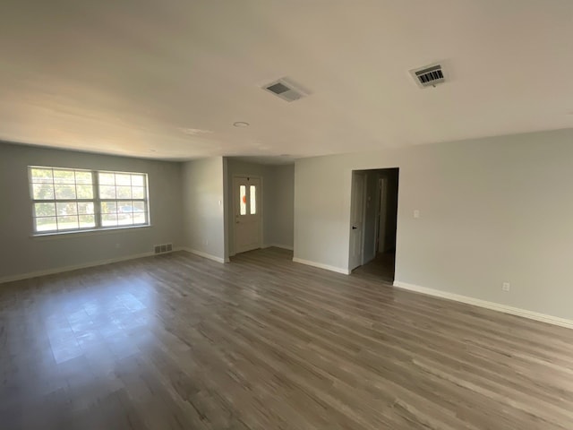 empty room with dark wood-type flooring