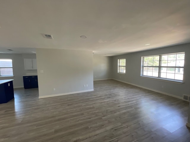 empty room with dark wood-type flooring