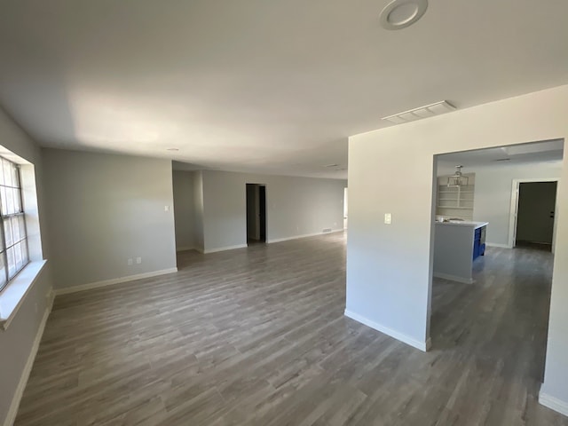 unfurnished room featuring dark hardwood / wood-style floors