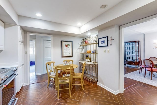 dining space with baseboards and recessed lighting