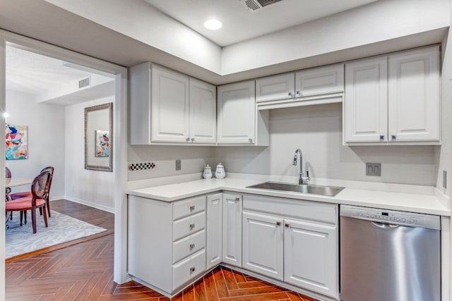 kitchen with dishwasher, sink, and white cabinetry