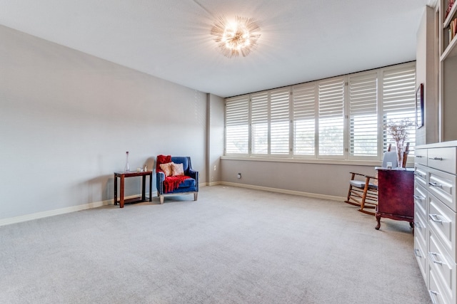 living area featuring light colored carpet