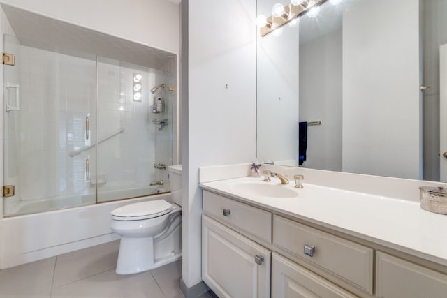 full bathroom featuring vanity, tile patterned flooring, toilet, and enclosed tub / shower combo