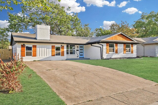 rear view of house featuring a yard and a patio