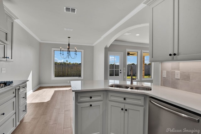 kitchen with dishwasher, light hardwood / wood-style floors, plenty of natural light, and sink