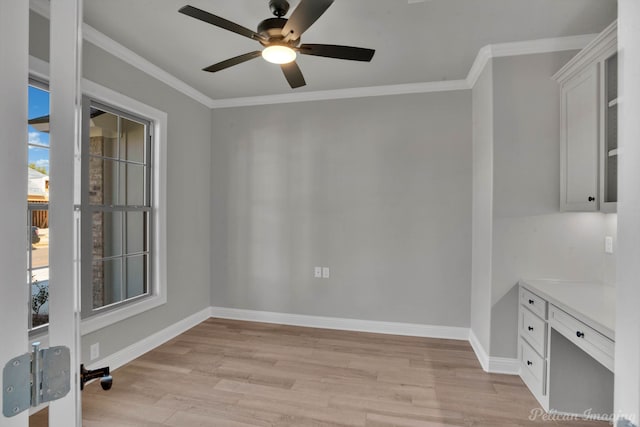 unfurnished dining area with ceiling fan, light hardwood / wood-style flooring, and ornamental molding