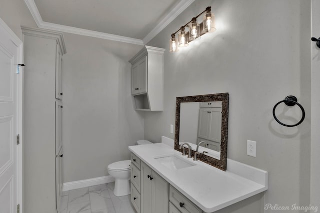 bathroom with toilet, vanity, and ornamental molding