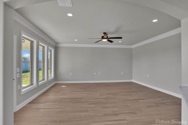 spare room with ceiling fan, light hardwood / wood-style floors, and crown molding