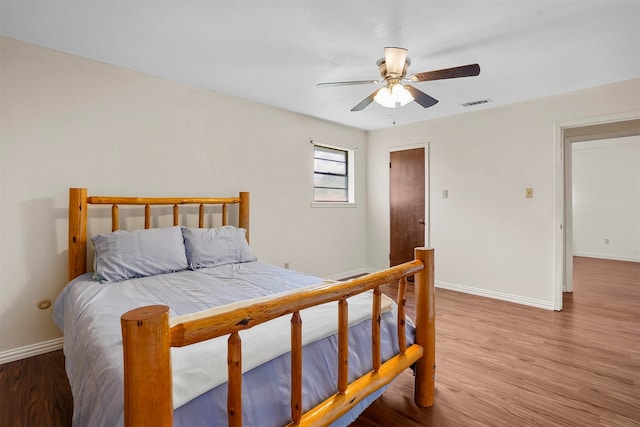 bedroom featuring ceiling fan and hardwood / wood-style flooring