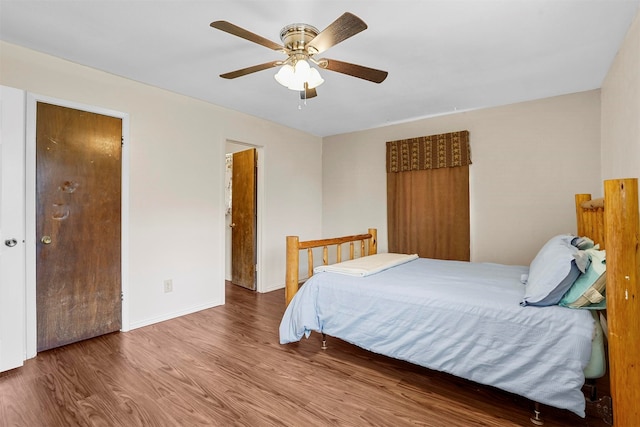 bedroom featuring wood-type flooring and ceiling fan