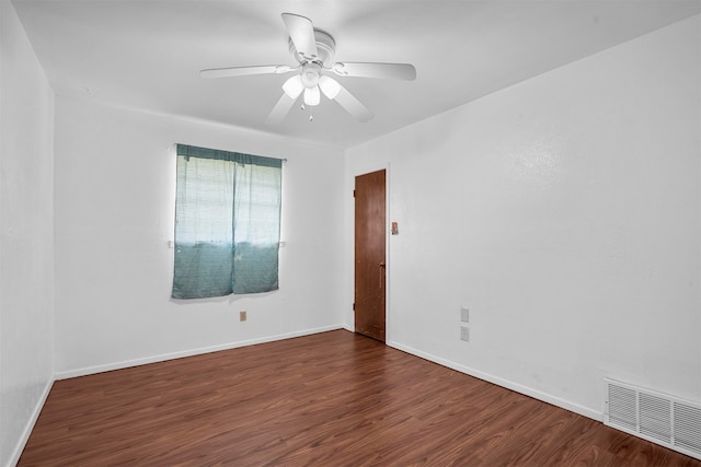 unfurnished room featuring dark hardwood / wood-style floors and ceiling fan