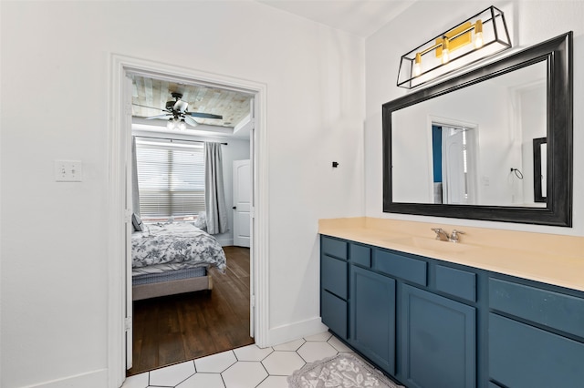 bathroom featuring vanity, hardwood / wood-style flooring, and ceiling fan