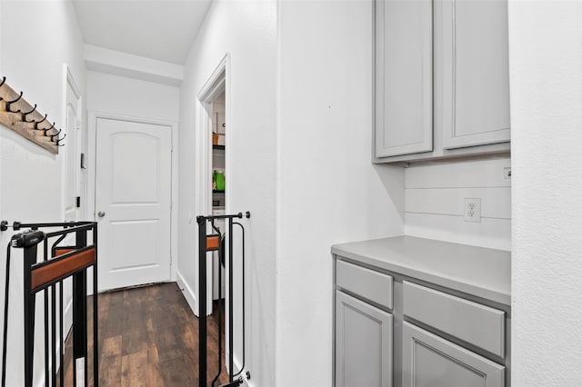 hallway featuring dark hardwood / wood-style flooring