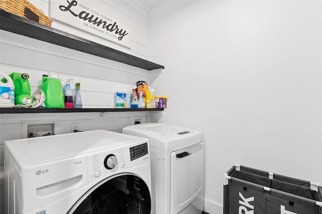 washroom with separate washer and dryer