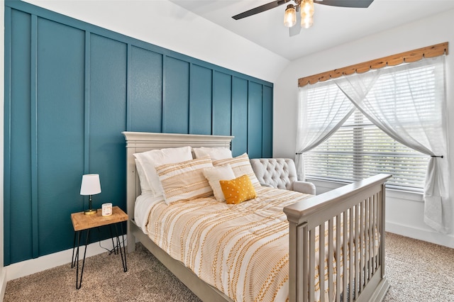 bedroom with lofted ceiling, light colored carpet, and ceiling fan