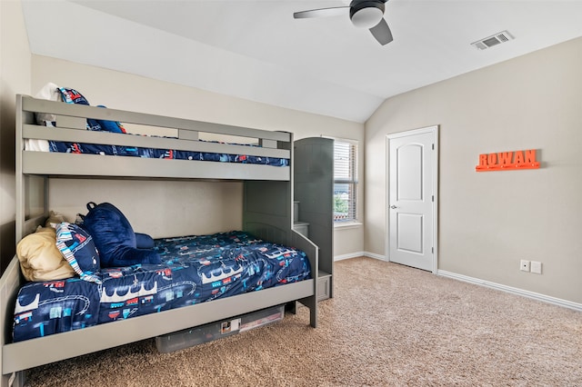 bedroom featuring ceiling fan, carpet flooring, and lofted ceiling