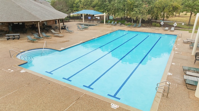 view of pool featuring a patio area