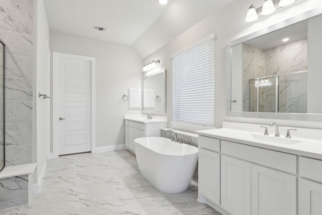 bathroom with vanity and independent shower and bath