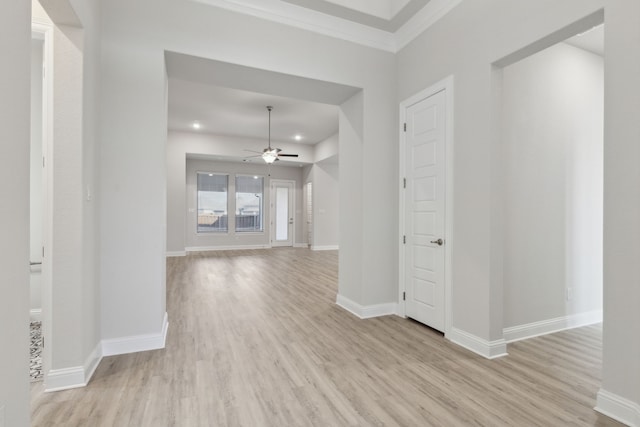 interior space with light wood-type flooring and crown molding