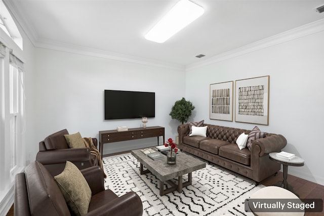 living room featuring light hardwood / wood-style floors and ornamental molding