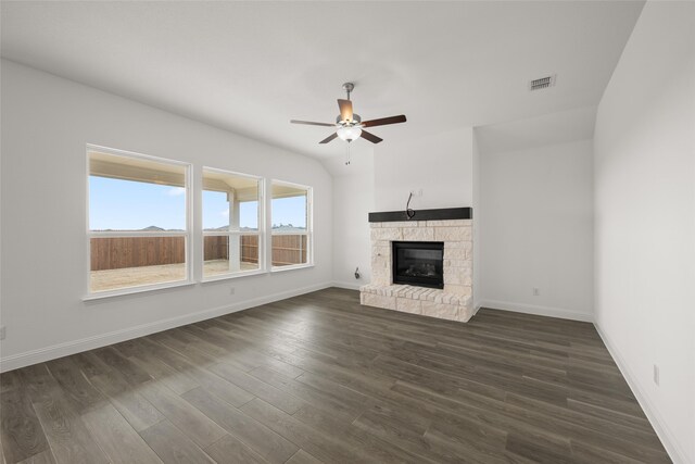 empty room featuring light hardwood / wood-style flooring, ceiling fan with notable chandelier, and a wealth of natural light