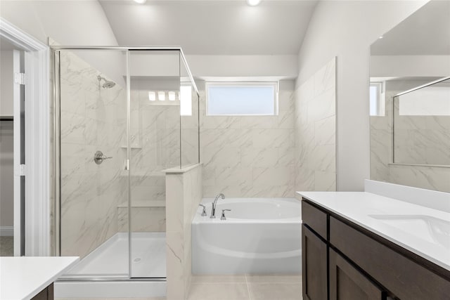 bathroom with vanity, independent shower and bath, and tile patterned flooring