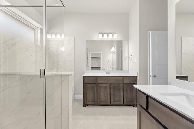 bathroom with vanity, tile patterned flooring, and an enclosed shower