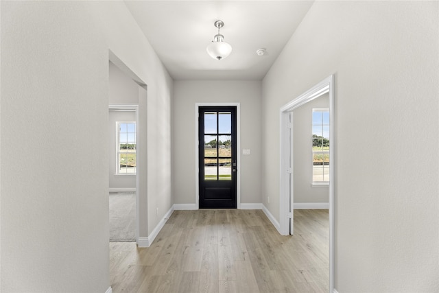 foyer with light wood-type flooring