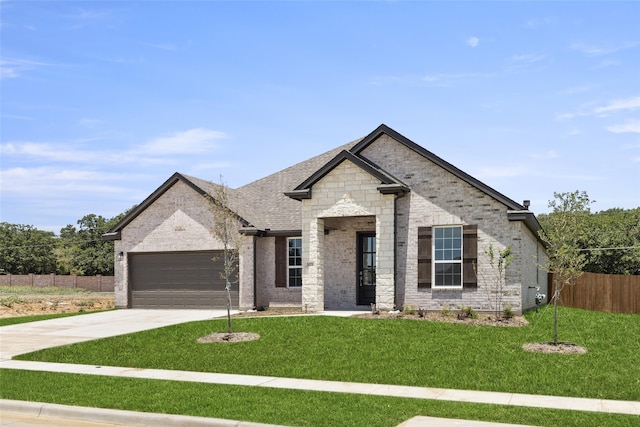 view of front facade with a front lawn and a garage