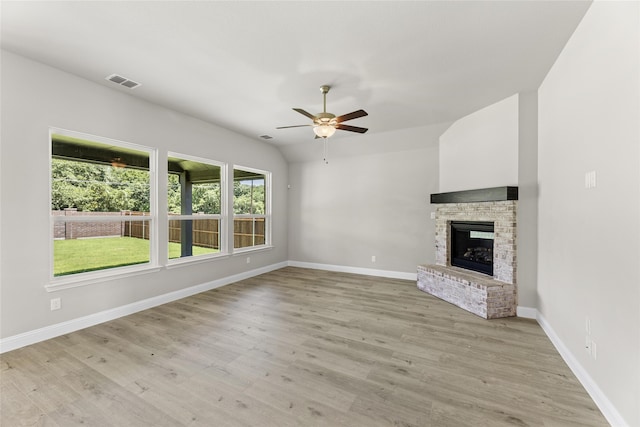 unfurnished living room featuring ceiling fan and light hardwood / wood-style flooring