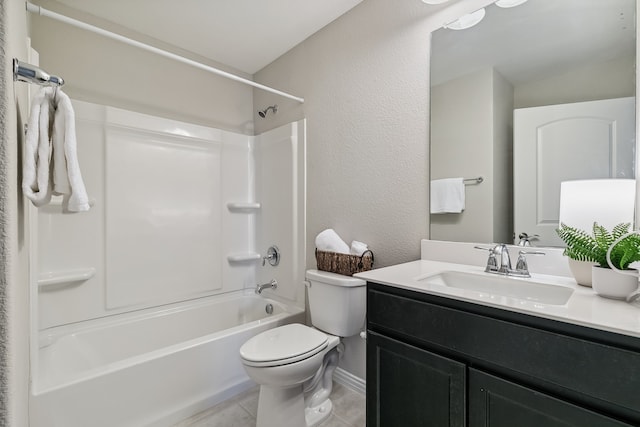 full bathroom featuring toilet, vanity, washtub / shower combination, and tile patterned flooring