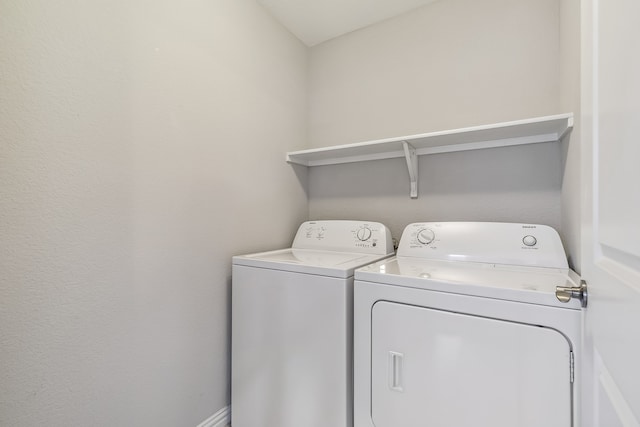 laundry area with independent washer and dryer