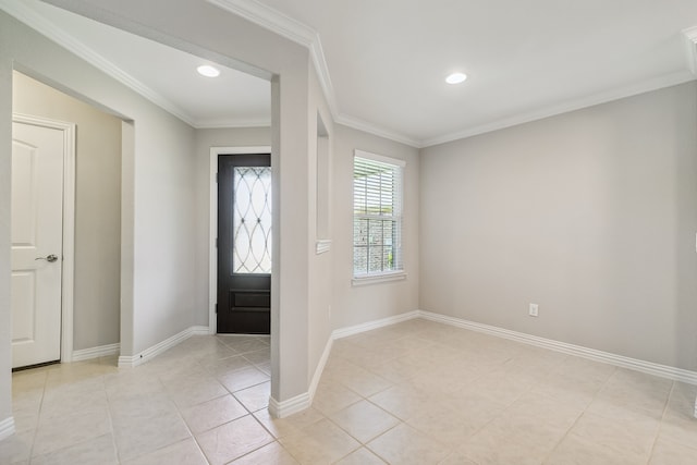 tiled entryway featuring ornamental molding