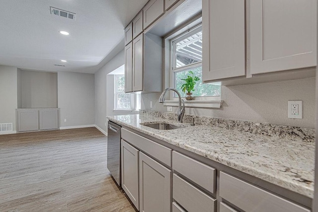 417 Lena Ln, Burleson, TX 76028 - kitchen featuring dishwasher, light wood finished floors, light stone countertops, recessed lighting, and gray cabinetry