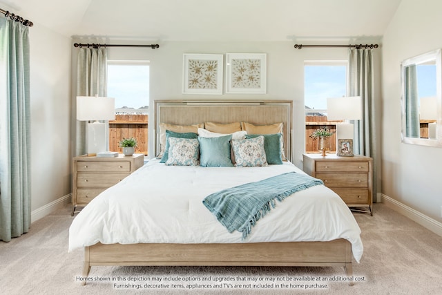 bedroom with vaulted ceiling and light carpet