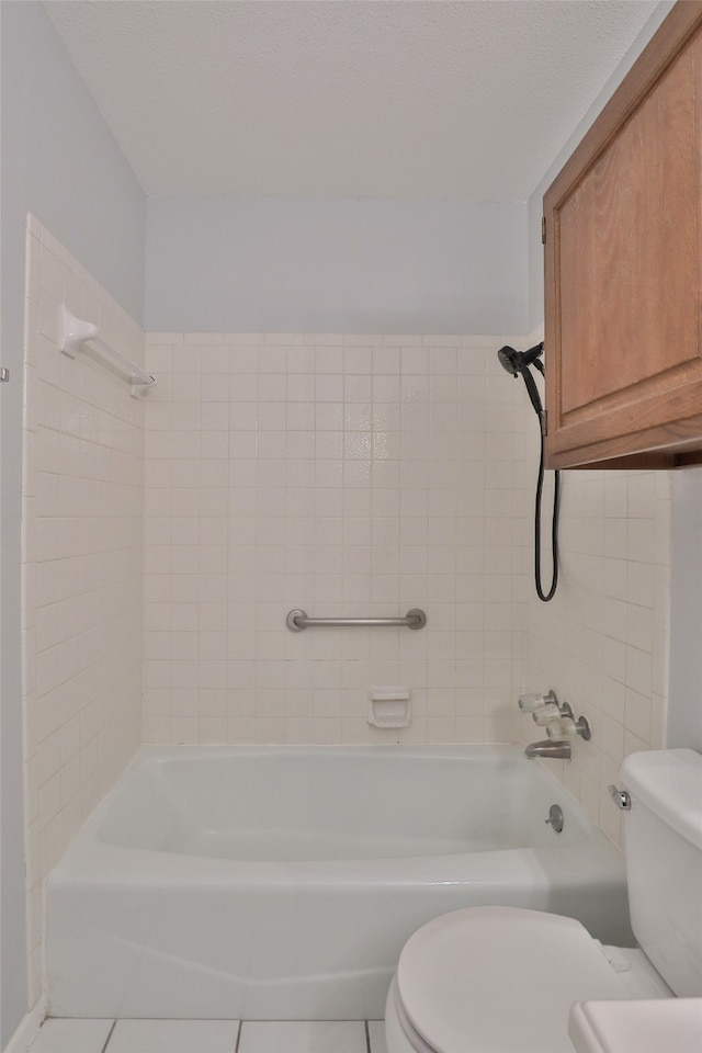 bathroom with tile patterned floors and toilet