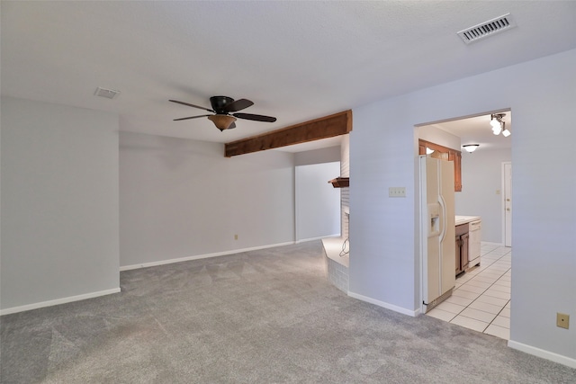 carpeted empty room with ceiling fan