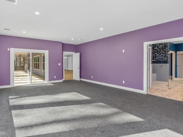 unfurnished bedroom featuring french doors, carpet flooring, and ensuite bath